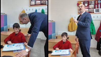 Doğanşehir’de karne dağıtım programında konuşan ilkokul öğrencisi Rüzgar, yaşadığı mahallenin